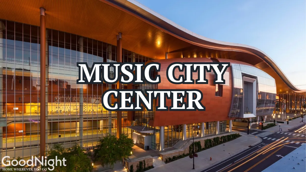 The exterior of the Music City Center building is prominently featured, framed by landscaped pathways and a vibrant street scene. The architecture is modern, with bustling activity outside that hints at the center's role as a hub for business events and conferences.